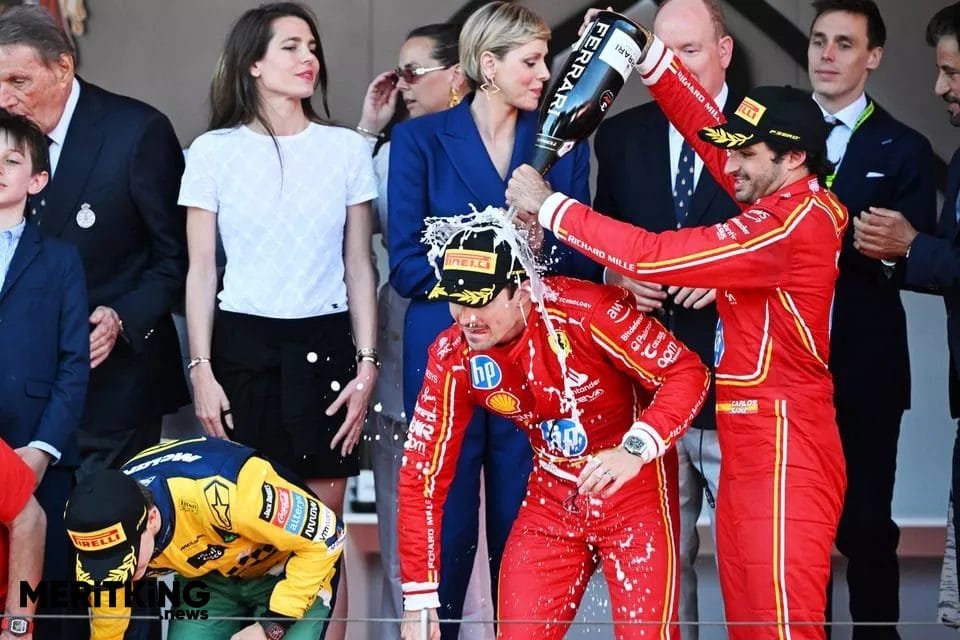 Ferrari Trento is sprayed on the F1 podium