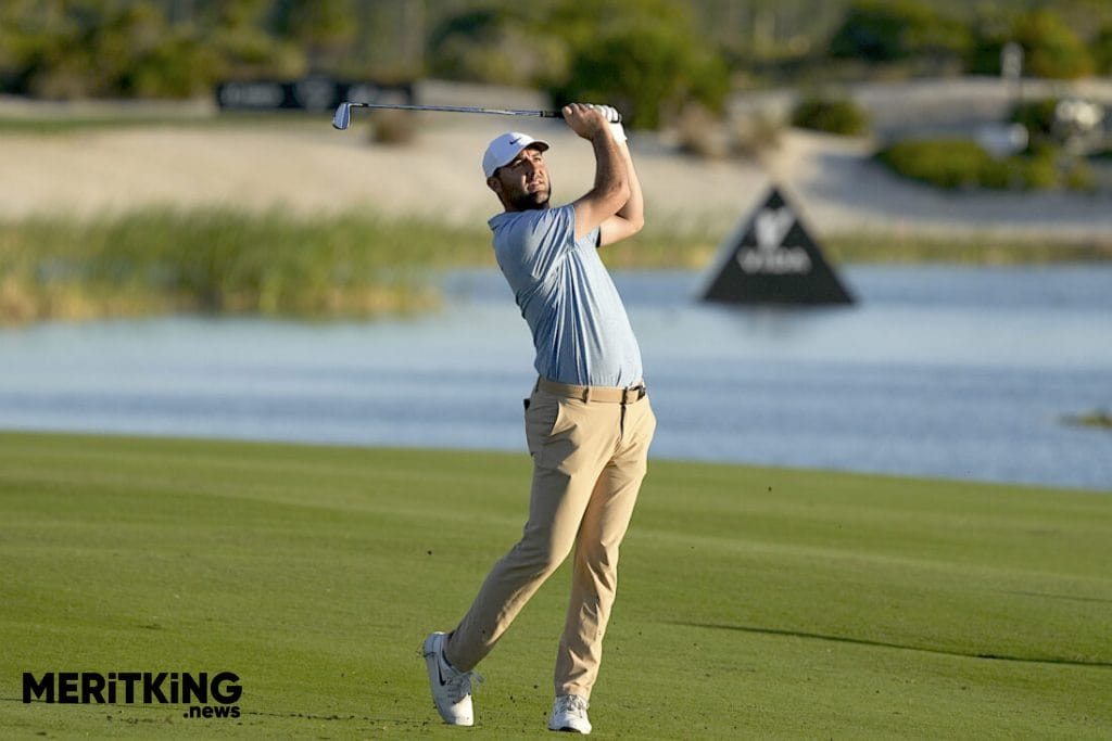 Scottie Scheffler, of the United States, watches his shot from the 18th fairway during the final round of the Hero World Challenge PGA Tour at the Albany Golf Club in New Providence, Bahamas, Sunday, Dec. 8, 2024. (AP Photo/Fernando Llano)